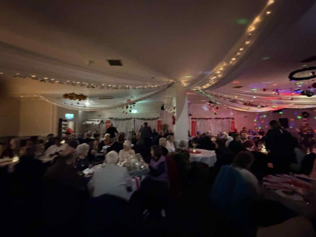 People enjoying a festive dinner party with decorations
