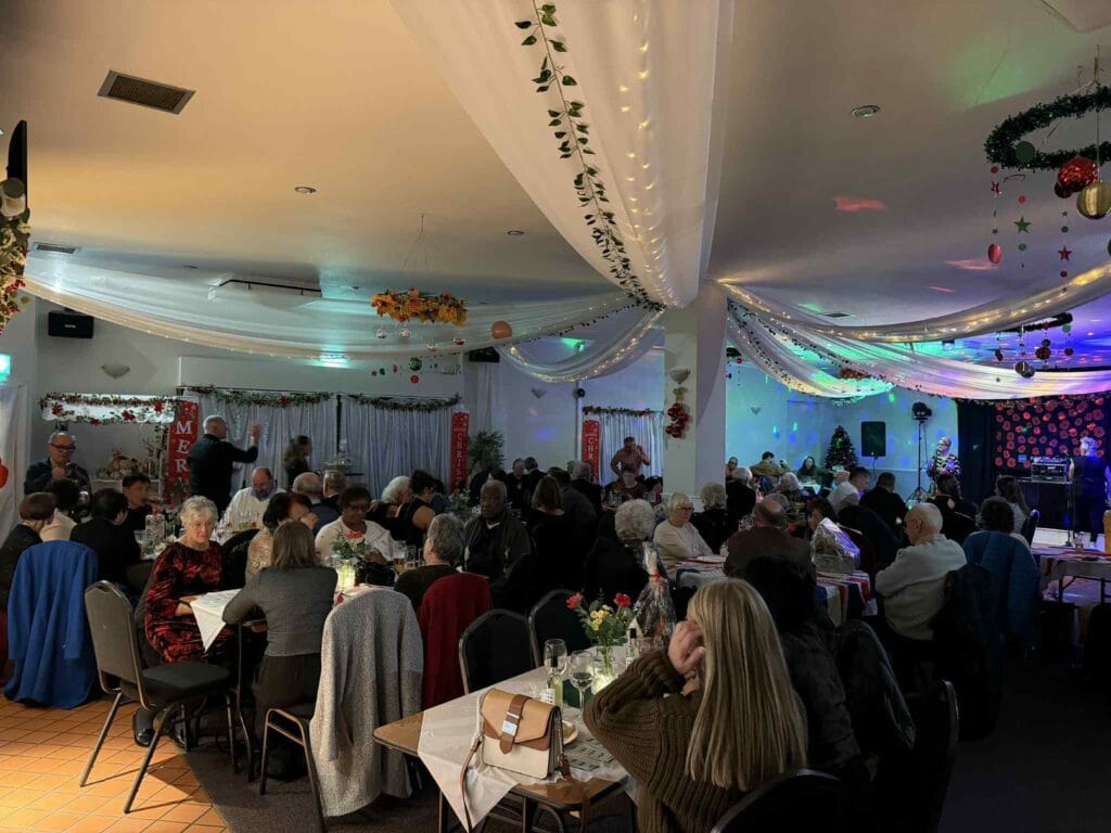 People enjoying a festive holiday dinner party.