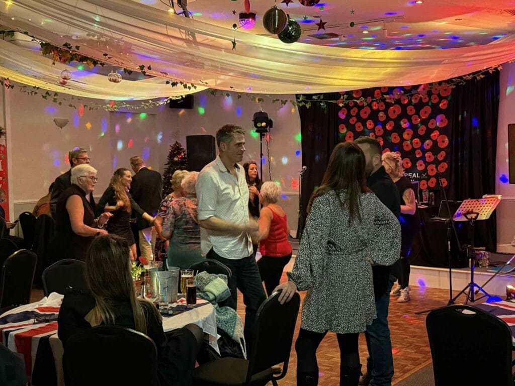 People dancing at a lively indoor party