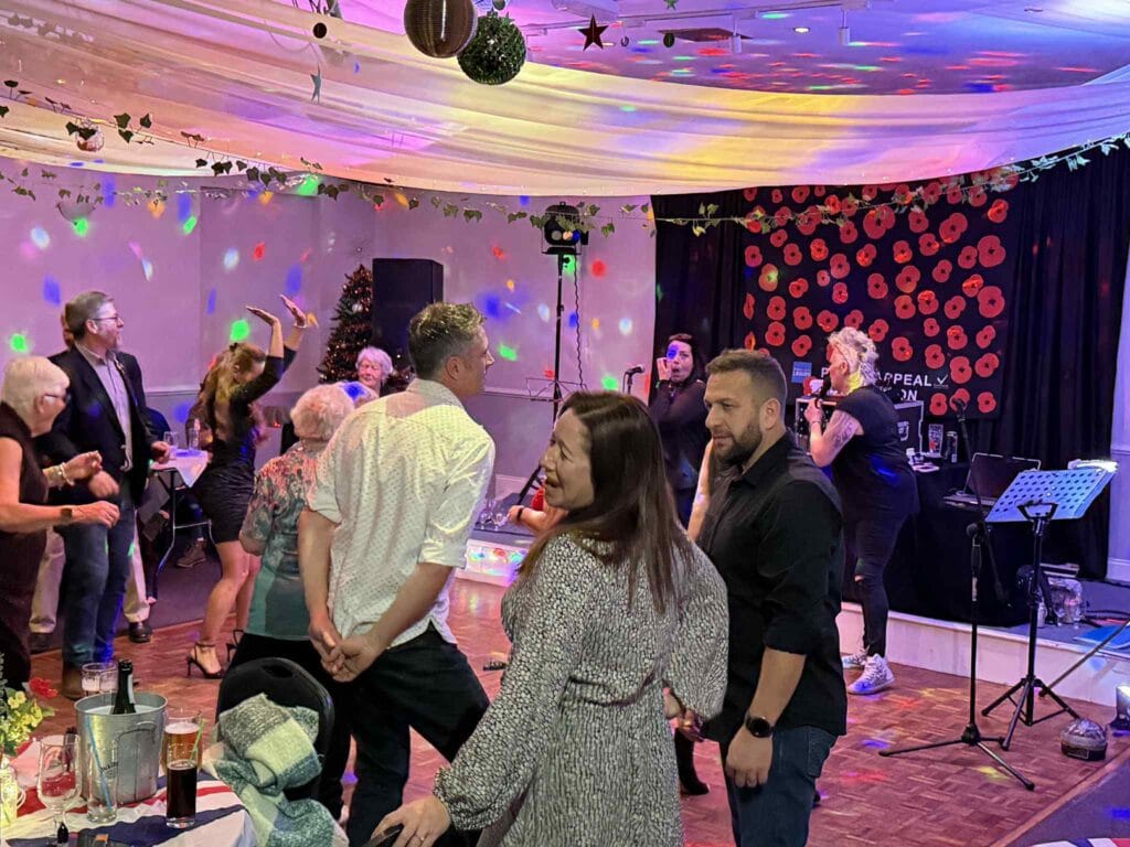 People dancing and enjoying a lively party indoors