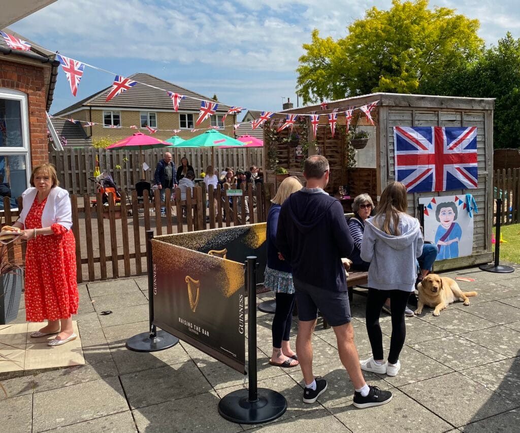 People celebrating British street party outdoors