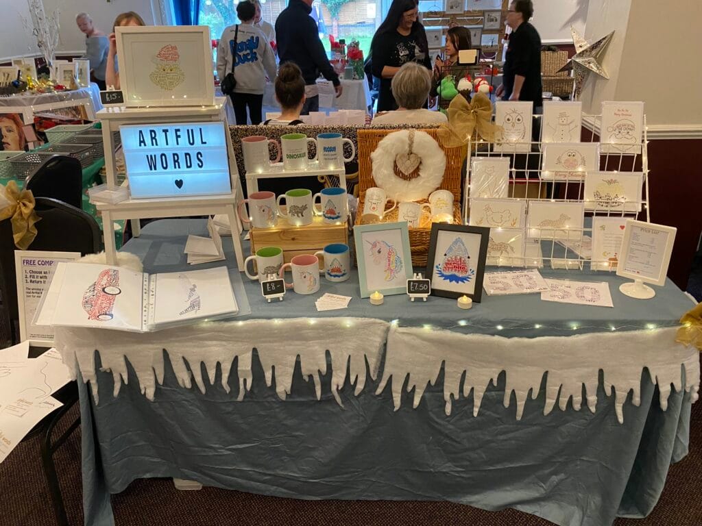 Artful Words stall selling illustrated mugs and prints