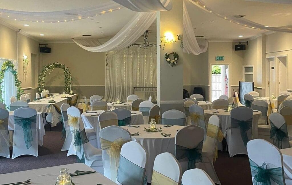 Elegant wedding reception hall with decorated tables