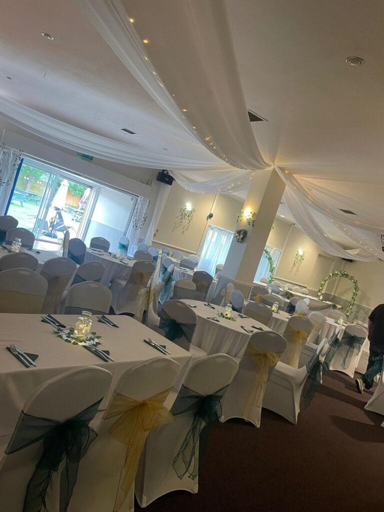 Elegant wedding reception hall with decorated tables