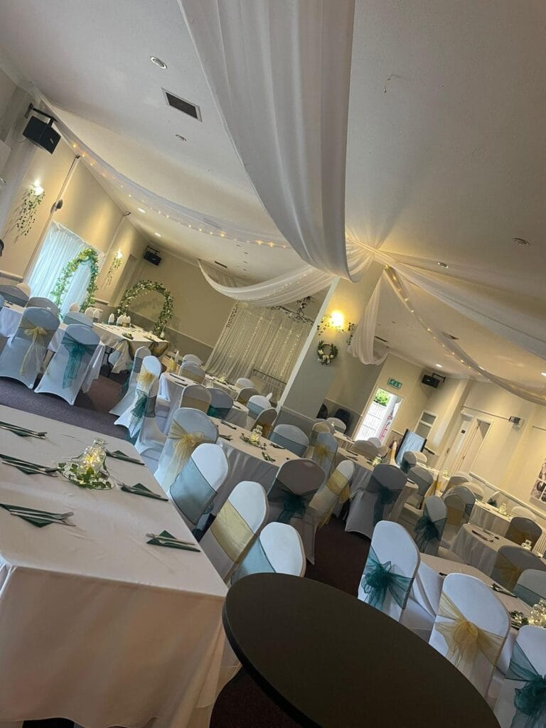 Decorated wedding reception hall with draped ceilings