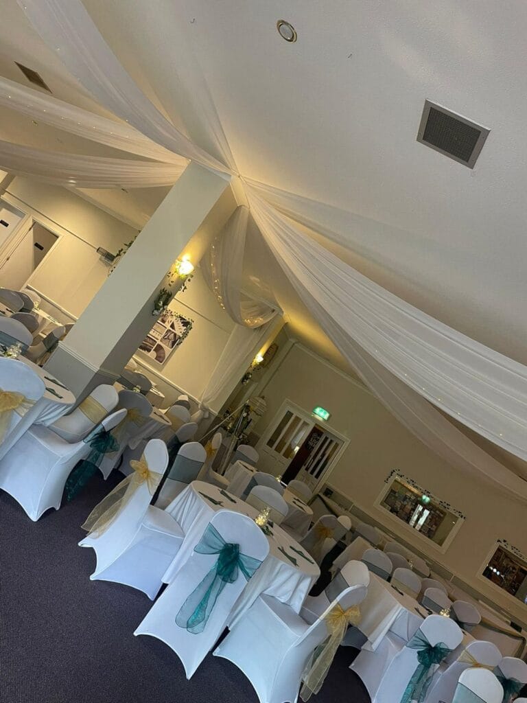 Elegant wedding reception hall with decorated tables