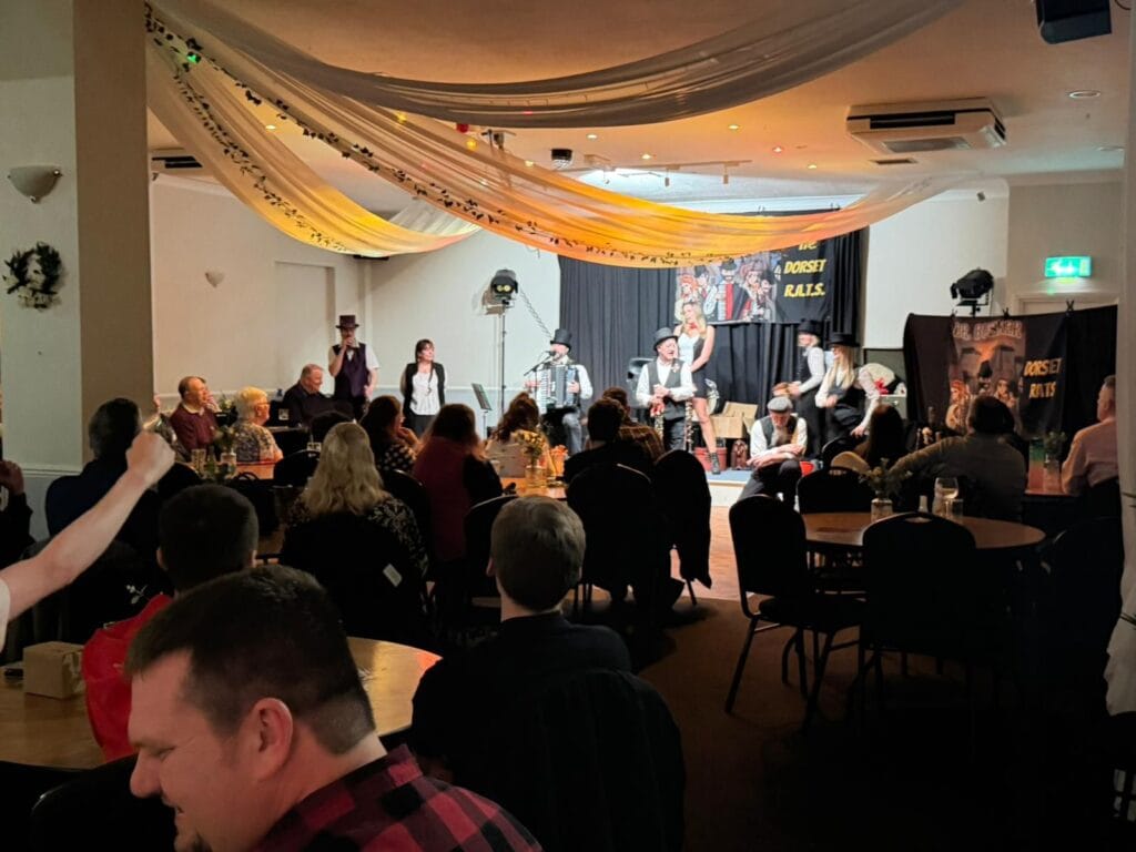 Live theatrical performance entertaining seated audience indoors